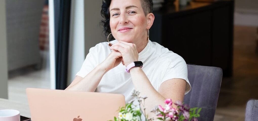 Inner child therapy newsletter and hypnotherapy London, image of Rowenna at her computer. Find out how inner child work heals childhood trauma.