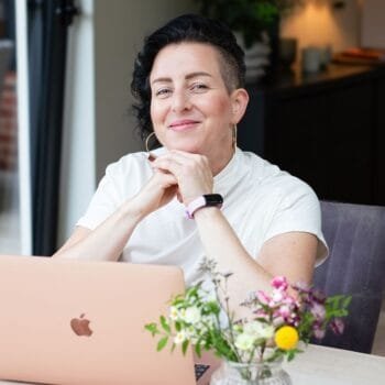 Inner child therapy newsletter and hypnotherapy London, image of Rowenna at her computer. Find out how inner child work heals childhood trauma.