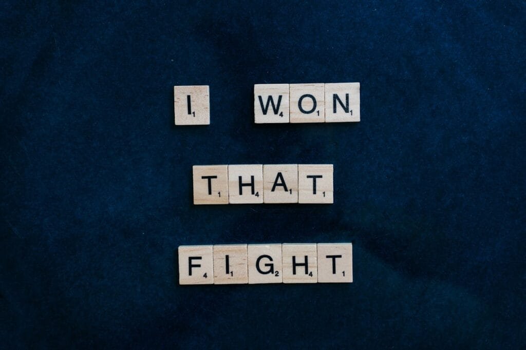 Hypnotherapy for alcohol. Image of some scrabble tiles spelling out "I won that fight".