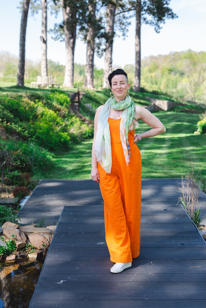 Image of Rowenna standing outside on an inner child therapy retreat