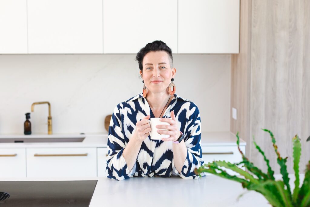 Image of Rowenna holding a cup of tea, attachment hypnotherapy, inner child work and NLP coaching and therapist coaching online UK