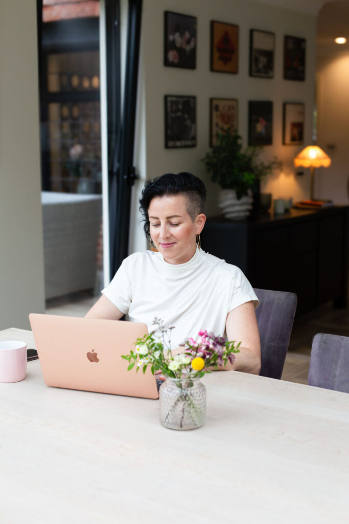 Image of Rowenna working at her laptop, therapist coaching with Rowenna