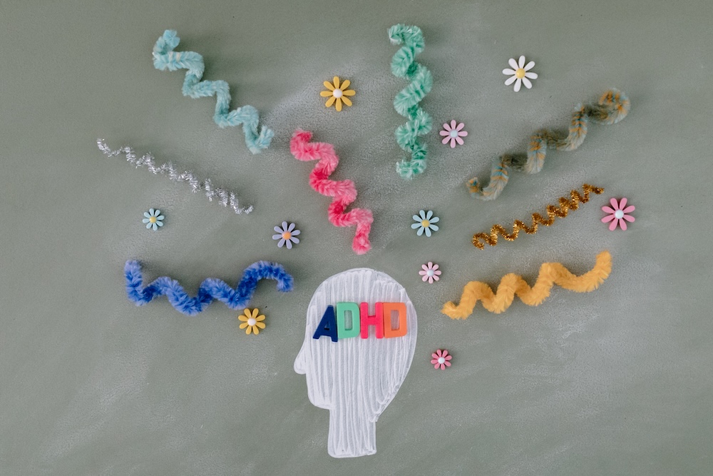 Image of a head shape with curled springs and jumbled objects coming from it, nlp coaching for ADHD
