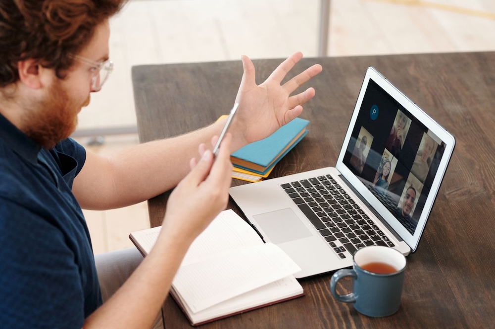 Image of a man taking part in an online therapist coaching session
